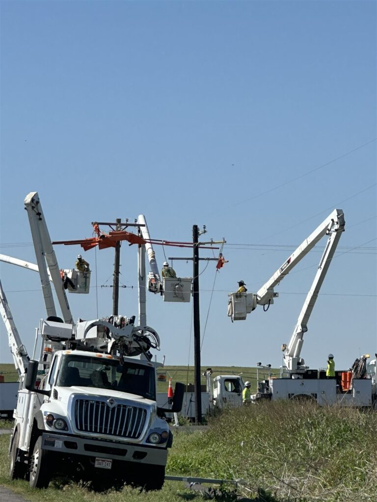 Bucket trucks on a utility construction job site