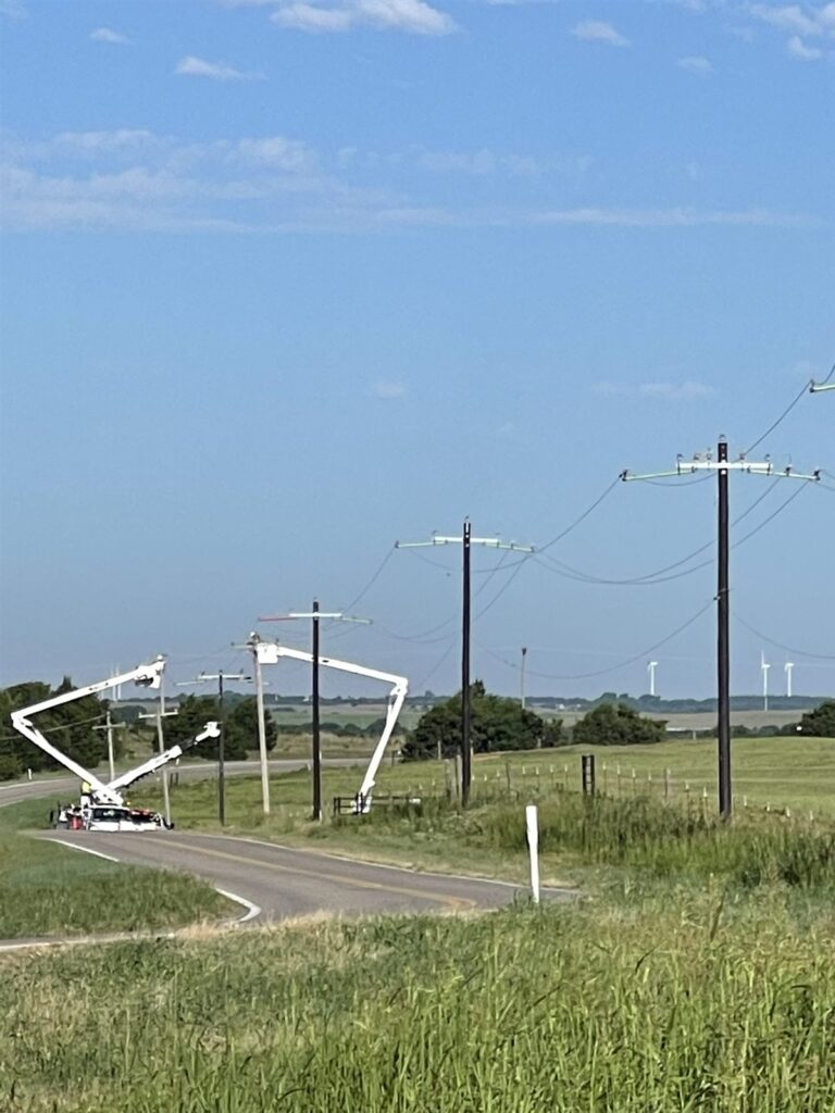 Pole line construction near a West Texas wind farm